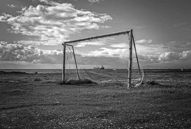 Black and 
                    white photo of an old soccer net
